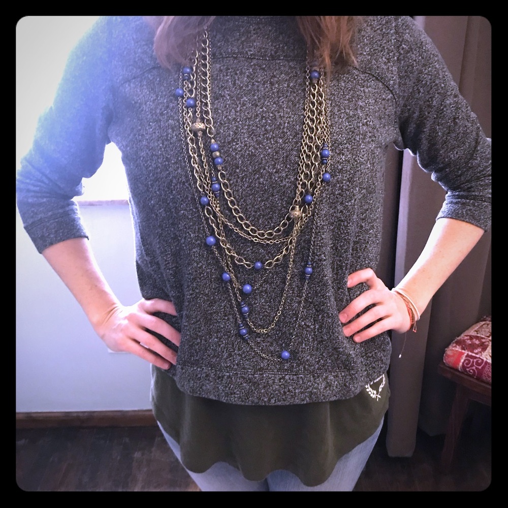 Gold multi-chain necklace with blue/purple beads
